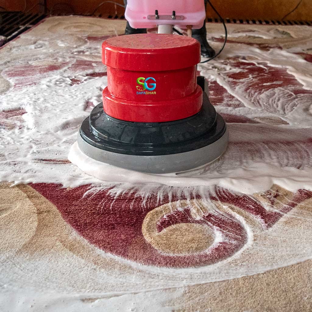 a man cleaning carpet